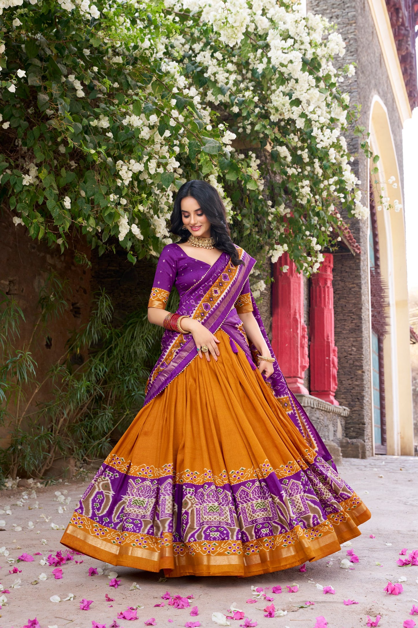 Yellow colour Tussar Silk and Patola Printed lehenga with dupatta