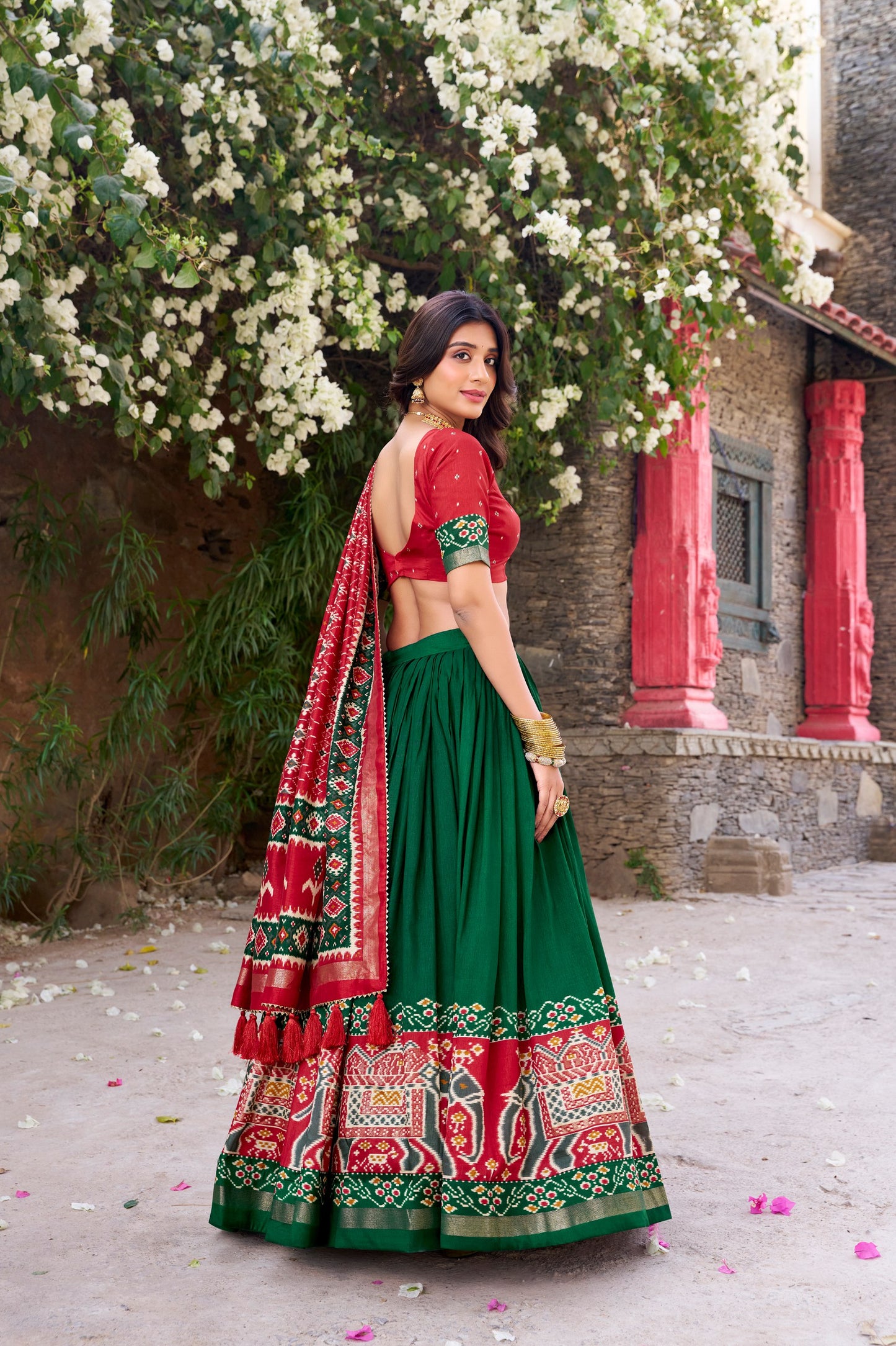 Green colour Tussar Silk and Patola Printed lehenga with dupatta
