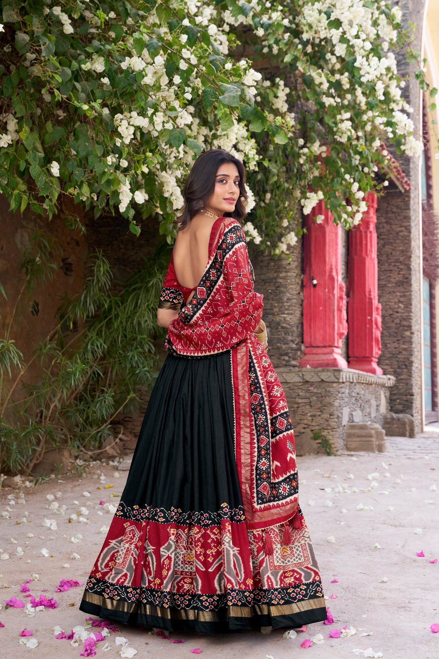 Black colour Tussar Silk and Patola Printed lehenga with dupatta