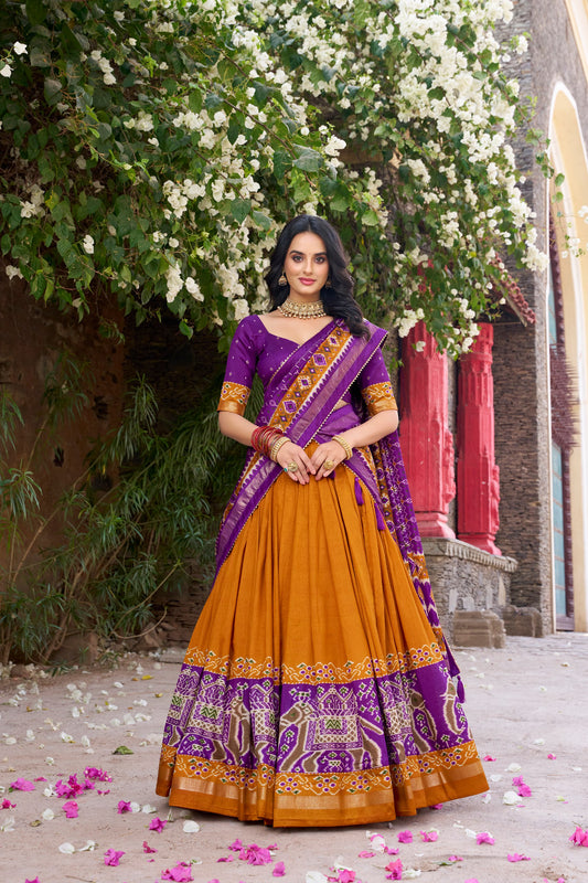 Yellow colour Tussar Silk and  Patola Printed lehenga with dupatta