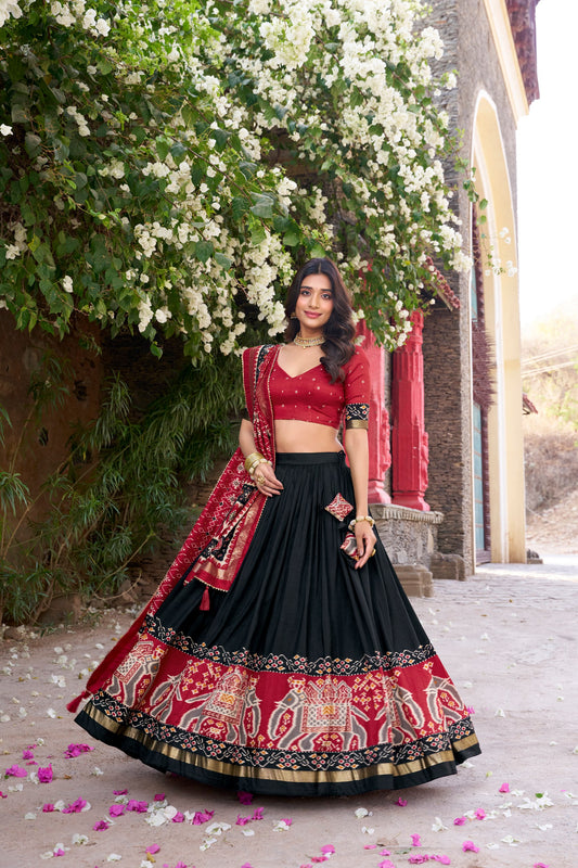 Black colour Tussar Silk and  Patola Printed lehenga with dupatta
