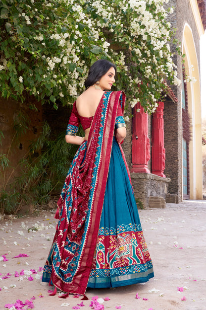 Blue colour Tussar Silk and  Patola Printed lehenga with dupatta