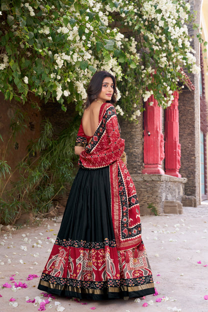 Black colour Tussar Silk and  Patola Printed lehenga with dupatta