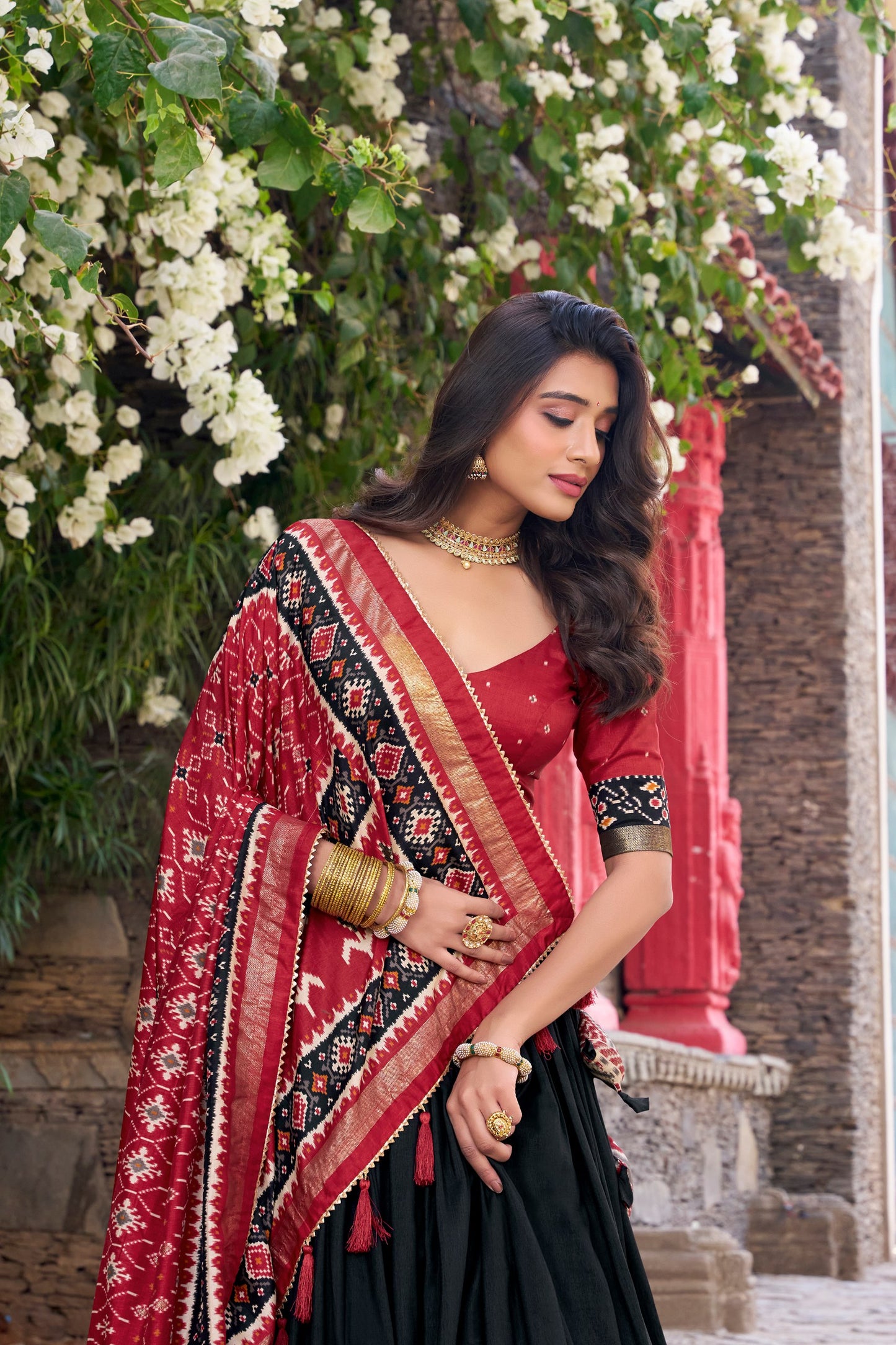 Black colour Tussar Silk and  Patola Printed lehenga with dupatta