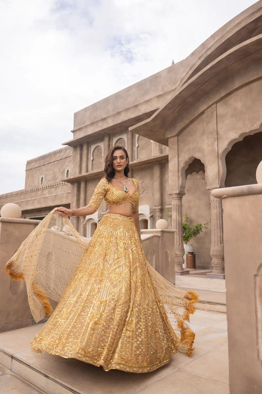 Gorgeous Golden Color Premium Soft Net With Sequence Work Party Wear Lehenga Collection